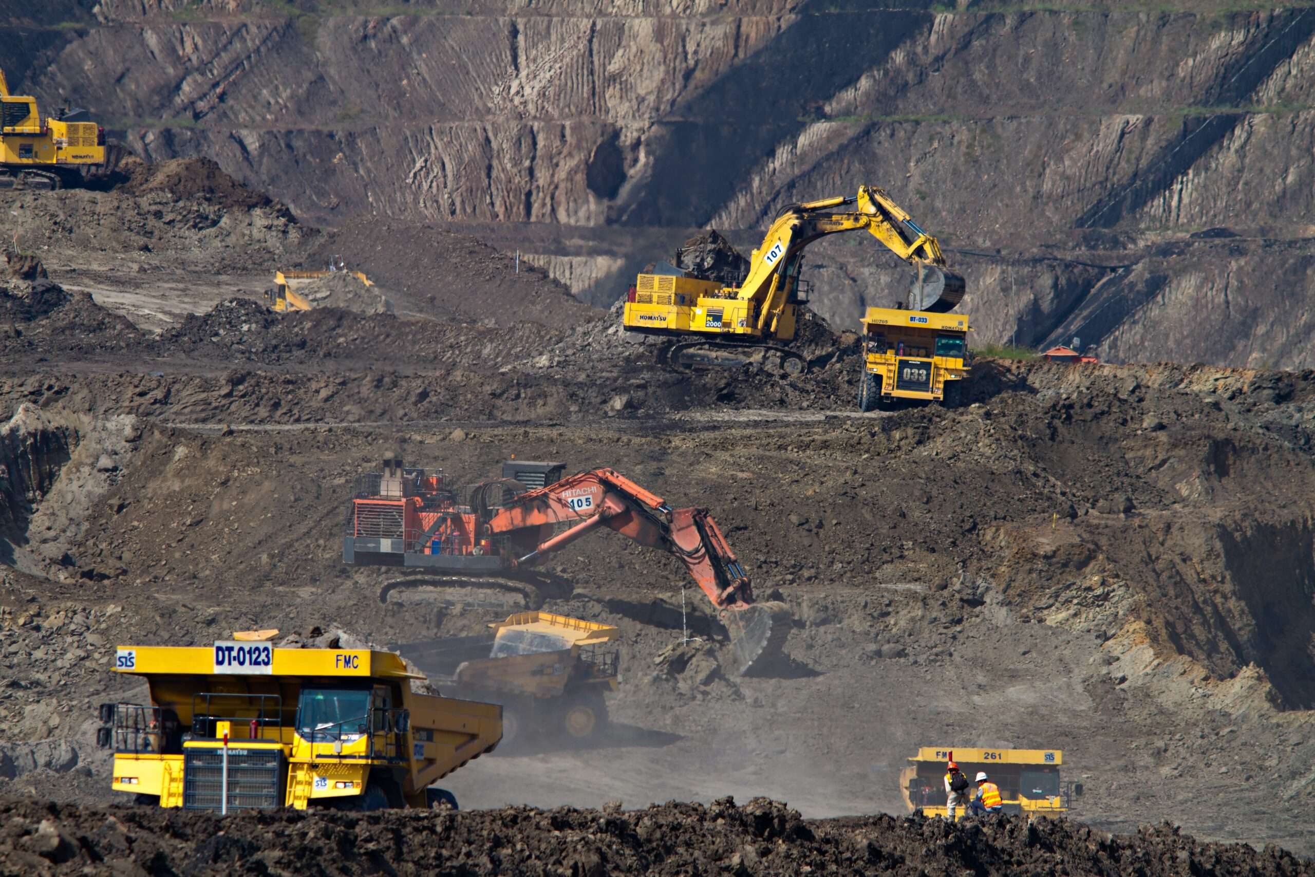trucks, excavators in open pit mine